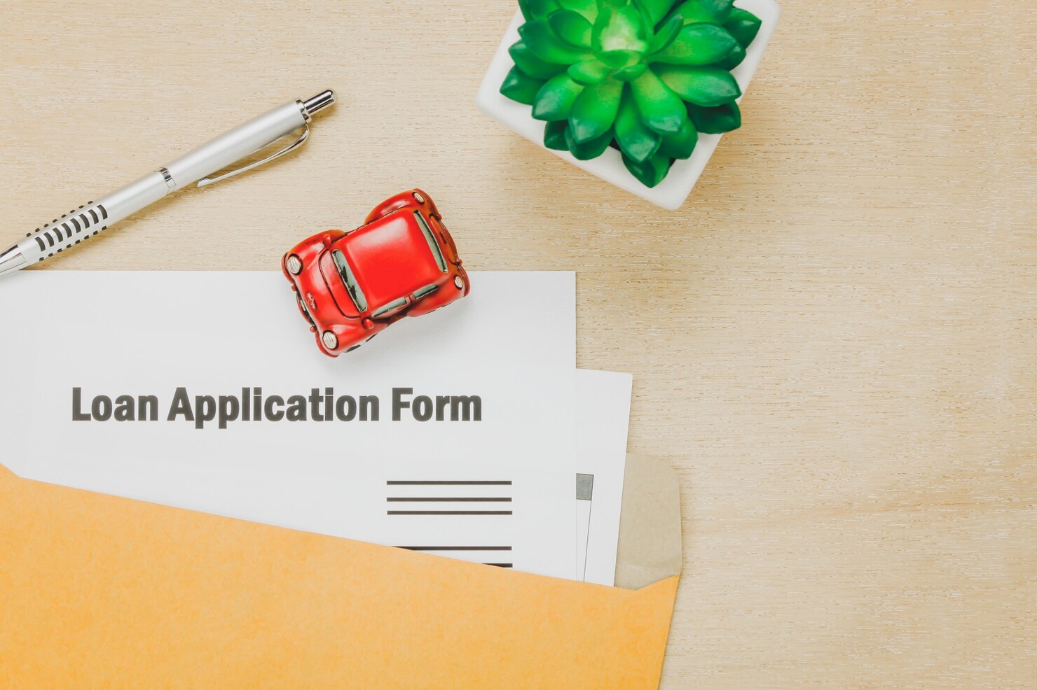 Top view of business office desk with loan application form